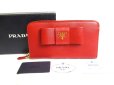 Photo1: PRADA Red Saffiano Leather Ribbon Motif Round Zip Long Wallet #a334 (1)